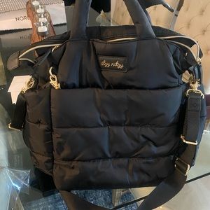 Black diaper bag, great for moms on the go. No tears, no scratches, many pockets